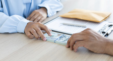 Businessmen give dollars to bribe employees in signing contracts to buy illegal land and real...