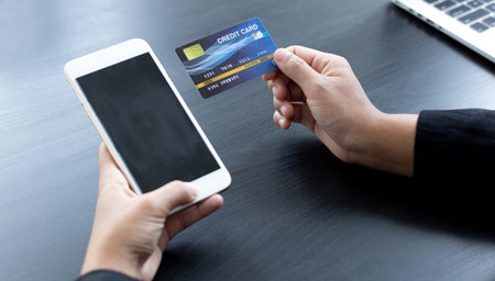 women use smart phone to register online purchases using credit card payments, Convenience in the...