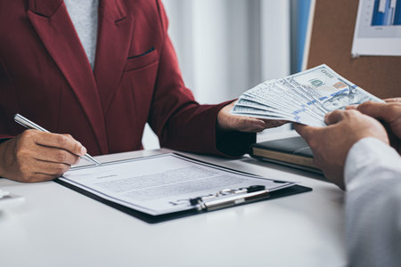 Businessmen give dollars to bribe employees in signing contracts to buy illegal land and real...