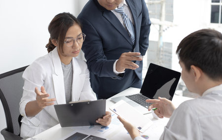 Business team meeting and presentation of works, Marketing department and data analysts propose ideas for driving sales strategies using graphs and charts, Brainstorming of business people.の写真素材