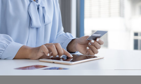 Women use Tablet to register online purchases using credit card payments, Convenience in the world...