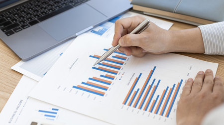 Accounting businessmen are calculating income-expenditure and analyzing real estate investment data,...
