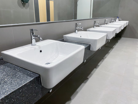 Public sinks, Handwashers for people using public toilets, Cleaning after using the toilet service, Public toilets and hygiene concept.のeditorial素材