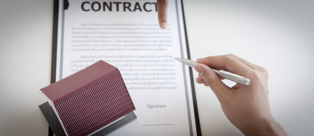 Sales manager or real estate agent will be prepared to show you a sample home and detail the terms of buying a home with insurance promotions, Attention to property services and insurance concept.の写真素材