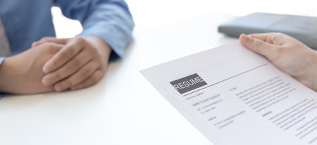 Employer or selection committee is reading the candidate's resume and competence background, Job interview by HR, History exam and work ability, Employment and Recruitment Concept.の写真素材