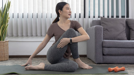 Slim fit Asian woman  Internet coach yoga and meditation coaching videos make them feel relaxed,...