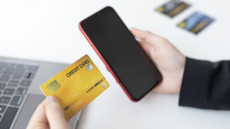 Businesswoman use mobile phones to register for security Online with a credit card to buy products...
