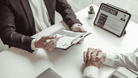 Employer or HR department is reading the resume and interviewing the ability of new employees,...