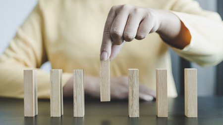 Strategies and risks of wooden games, Close-up of business people gambling with investment risk,...