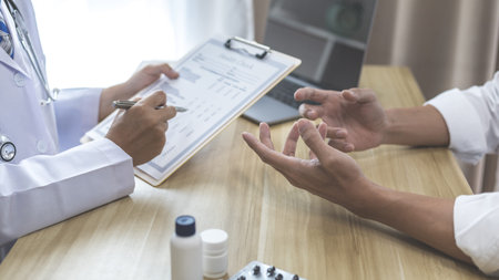 Male doctor made a diagnosis on a male patient and gave advice on treatment methods in the hospital...