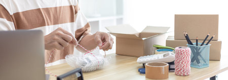 Man is packing in the mailbox to prepare to deliver it to the customer, Working at home and owning...