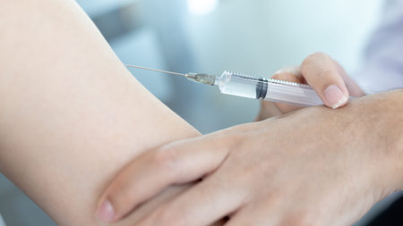 Doctor vaccinating patient, vaccination against new strains of virus, Doctor holding a syringe,...