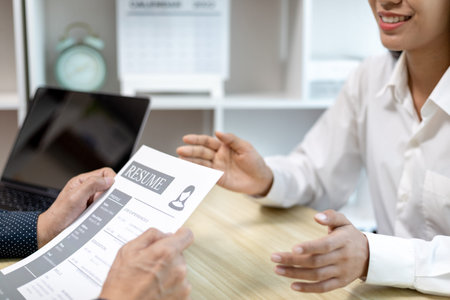 Job interview, Employer or recruiter is interviewing and taking the applicant's work history,...