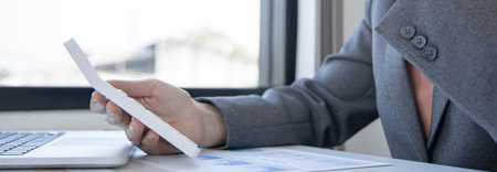 Accounting businesswomen are calculating income-expenditure and analyzing real estate investment data, Dedicated to the progress and growth of the company, Financial and tax systems concept.の写真素材