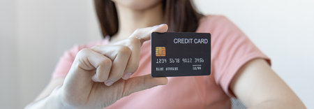 Asian women use a credit card to pay through online purchases, Payment by credit card or online banking, Shopping and mail, credit card online security.の写真素材