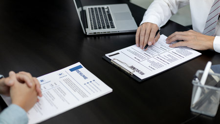Employer or HR department is reading the resume and interviewing the ability of new employees, job interview with applicants, Using psychology in job interviews, Employment and Recruitment Concept.の写真素材