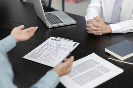Job interview, Employer or recruiter is interviewing and taking the applicant's work history,...