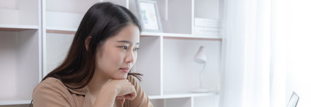 Women are greeting friends and teachers through video chats and greeting them with cheerful expressions, Online communication , Stay home, New normal, VDO Call, Social distancing, Internet learning.の写真素材