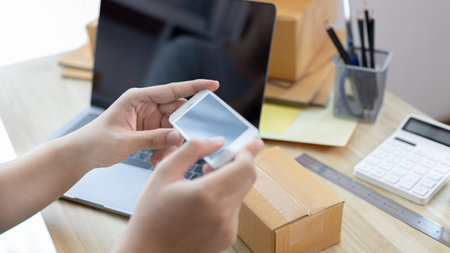 Man taking a photo of product in box postbox with a mobile phone, Identity verification or order...