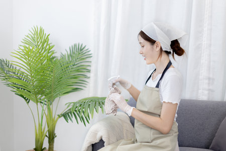 Beautiful Asian woman uses laptop to communicate work, Working from home at home happily, Freelancers work or learn in private rooms at home, Online communication, Home lifestyle.の写真素材