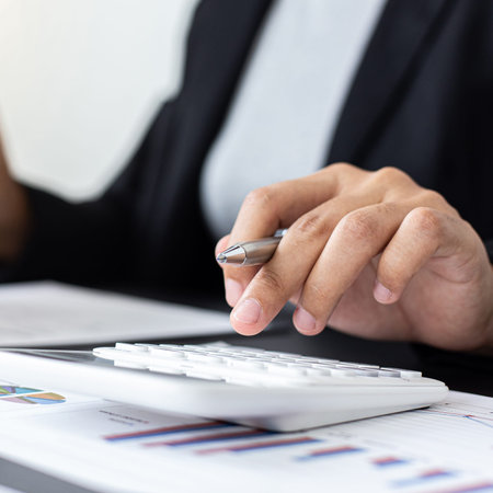 Accounting businessmen are calculating income-expenditure and analyzing real estate investment data,...
