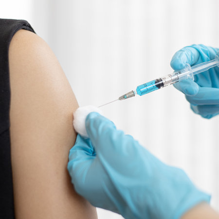 Doctor is vaccinating women with antibiotics or new antibodies to prevent the spread of the virus, Vaccination against communicable diseases conceptの写真素材