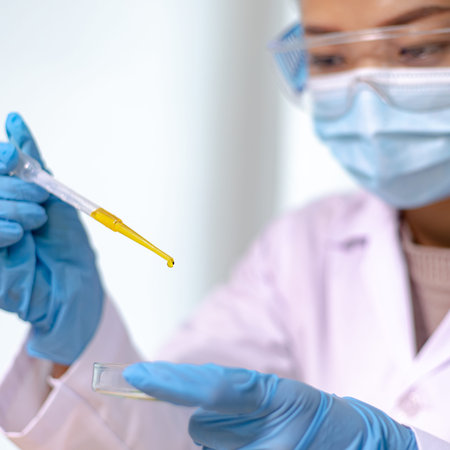 Scientists or doctors are analyzing new strains of antiviral drugs to inject vaccines for patients...