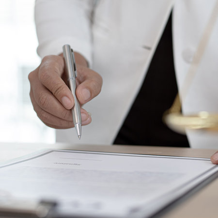 Judge or a lawyer works documents in the courtroom and analyze the various laws for justice and...