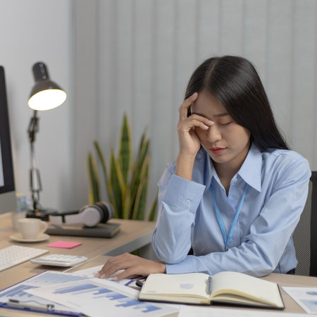 Asian female staffers are disappointed by the mistakes made,Despair or disappointment, Failure of...