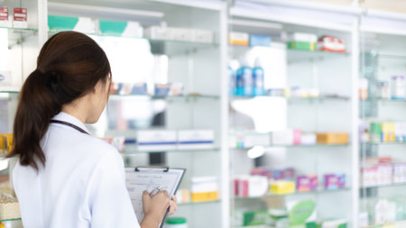 Pharmacist working in a pharmacy, Consultation and medical advice, All kinds of generic household drugs and pharmaceutical products on the shelf, Service and assistance to patients, Pharmacy.の写真素材