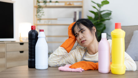 Housewife is fed up with cleaning the house and bathroom that has deep stains that are difficult to clean, Housework, Big cleaning, Stressed with housework, Clean up on weekends.の写真素材