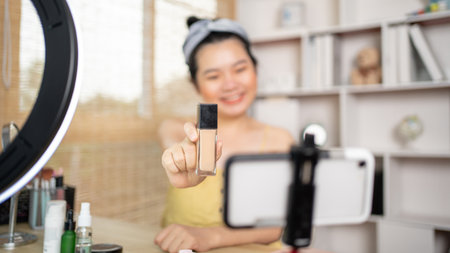 Beautiful women with social media influences recommend products and make-up accessories to be more beautiful, Recording vlog video live streaming, Online business of beauty bloggers.の写真素材