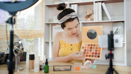 Beautiful women with social media influences recommend products and make-up accessories to be more beautiful, Recording vlog video live streaming, Online business of beauty bloggers.の写真素材