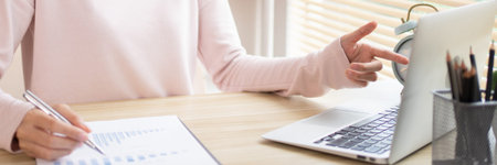 Businesswoman analyzes data graphs and works intently in his personal office, Employees working in...
