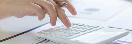 Accounting businessmen are calculating income-expenditure and analyzing real estate investment data,...