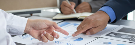 Business team meeting and presentation of works, Marketing department and data analysts propose ideas for driving sales strategies using graphs and charts, Brainstorming of business people.の写真素材