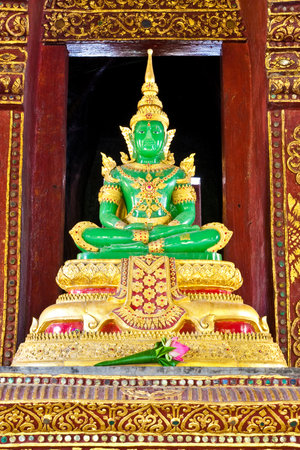The Emerald Buddha Mock from the temple of Wat Phra Kaeo at the Grand Palace in Bangkok, Thailand.  This photo from Wat Phrasing, Chiangmai, Thailandの写真素材