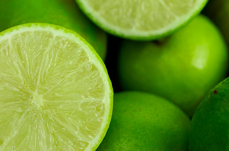 Fresh green limes as backgroundの写真素材