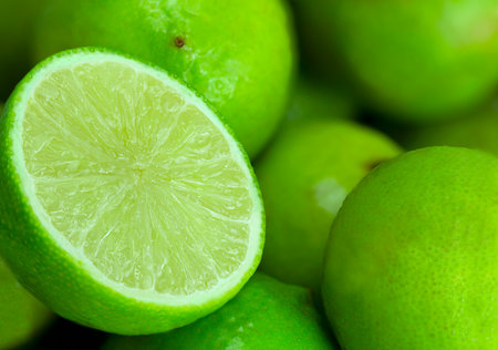 Fresh green limes as backgroundの写真素材