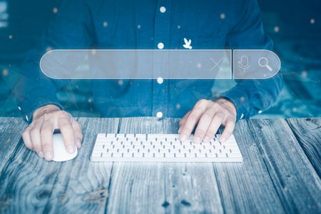 Male hand using computer keyboard to search information, using search bar function on your website, search engine optimization, information search technology, virtual screen search.の写真素材