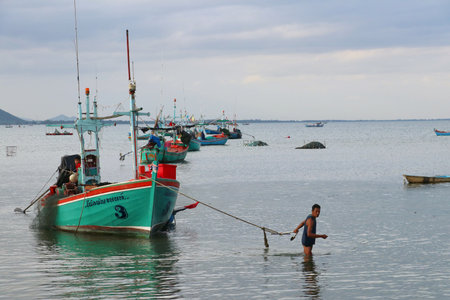 Prajuab Kirikhan, Thailand - 7 September 2019 : Fisherman with his boat.のeditorial素材