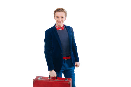 portrait of Businessman sitting on his suitcase ready for your designの写真素材