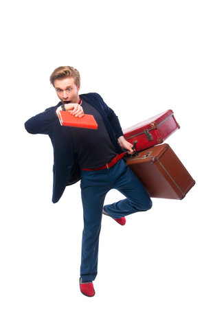 portrait of Businessman holding a suitcase while looking at his watch. ready for your designの写真素材