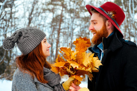 young couple in the winter forest