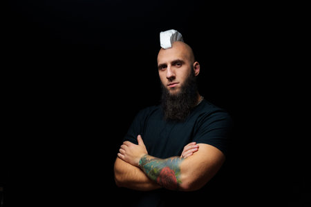 Funny musician mohawk with shaving foam covered faceの写真素材