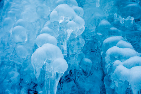 frozen small mountain waterfall close upの写真素材