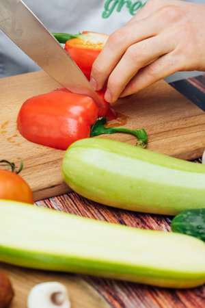Cut zucchini on chopping board for cooking