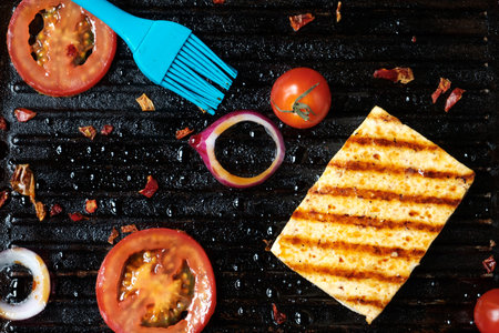 ofu on the grill on the table on a black background, view from the topの写真素材