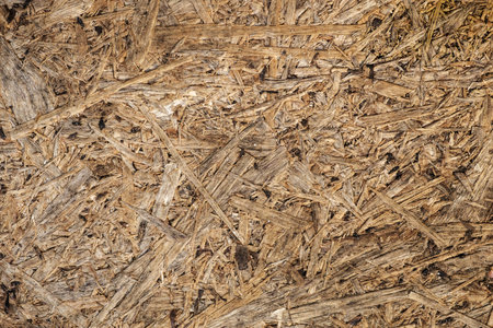 Surface of Pressed Wood Close up. Particleboard Background Texture.