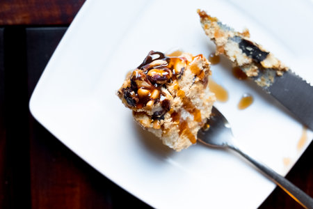 Cake with walnuts and honey on plate. Top view.の写真素材